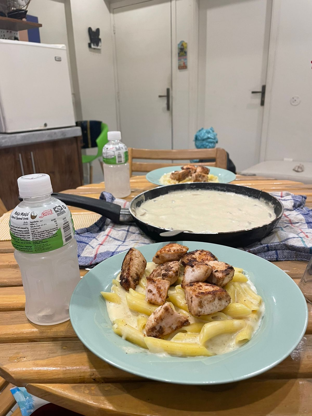 Our table with pasta, chicken, and Mogu Mogu