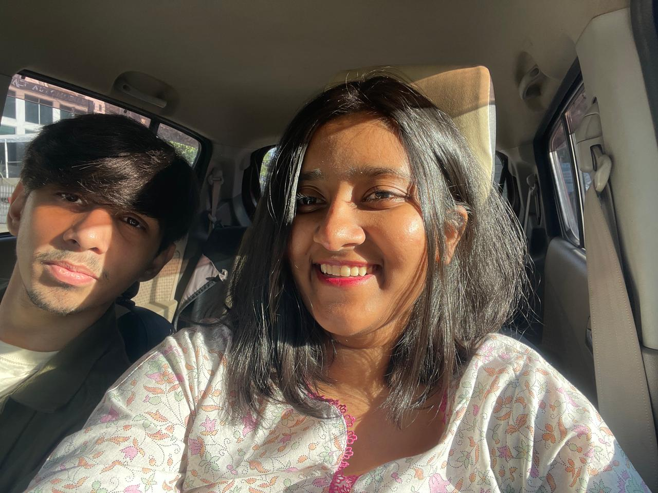 Us in the car, sunlit and smiling